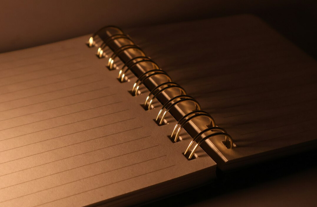Close-up of a reporter's notebook and pen