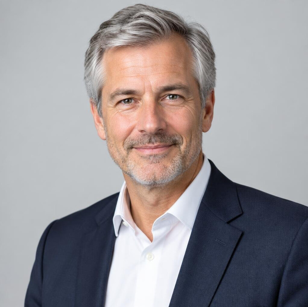 Studio portrait of a man editor in a suit jacket